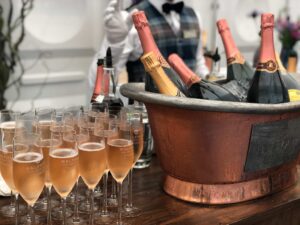 Champagne in a bucket on a table.