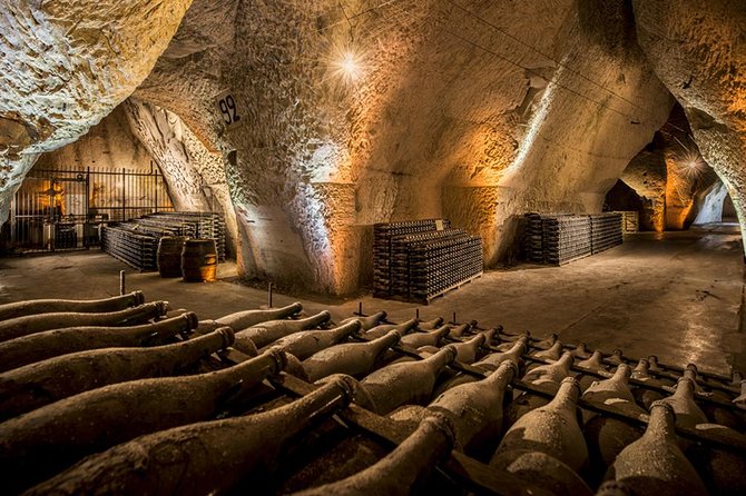 A cave full of wine bottles in a cave.