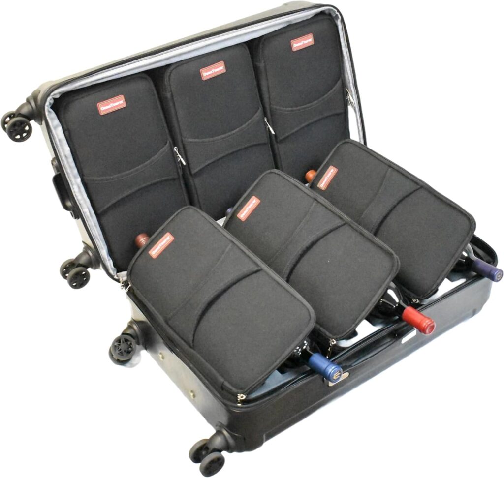 A wine suitcase with four bottles in it.