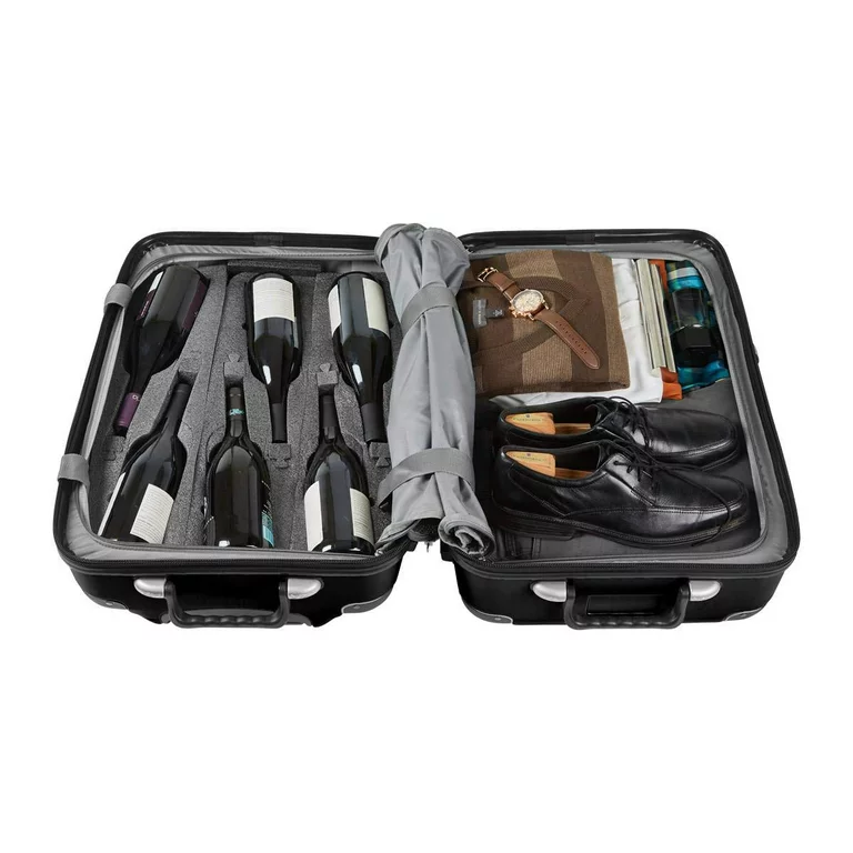 A black wine suitcase with shoes inside.