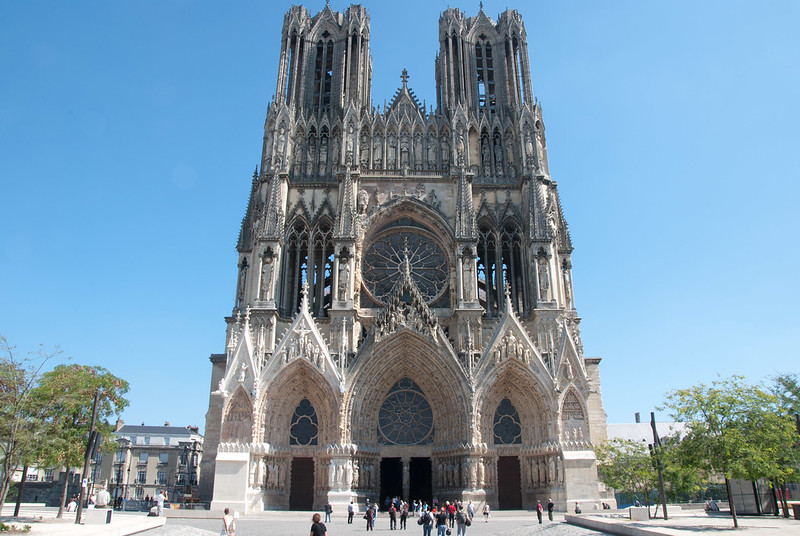 Reims, a large cathedral in the middle of a city.