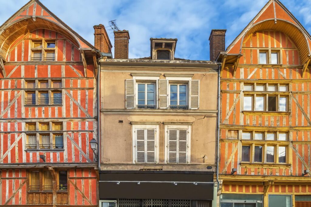 A row of old buildings in a town in France, including a Troyes restaurant.