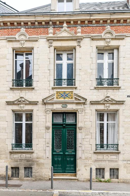 An old building with a green door.