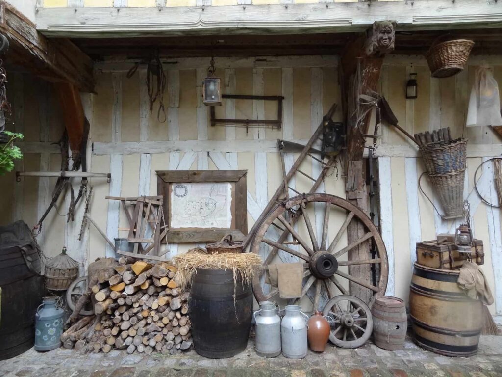 An enchanting collection of old fashioned items on display in front of a building, showcasing the rich history and charm of Troyes.