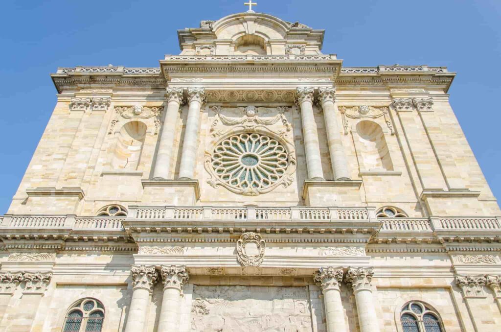 An ornate building with a large window.