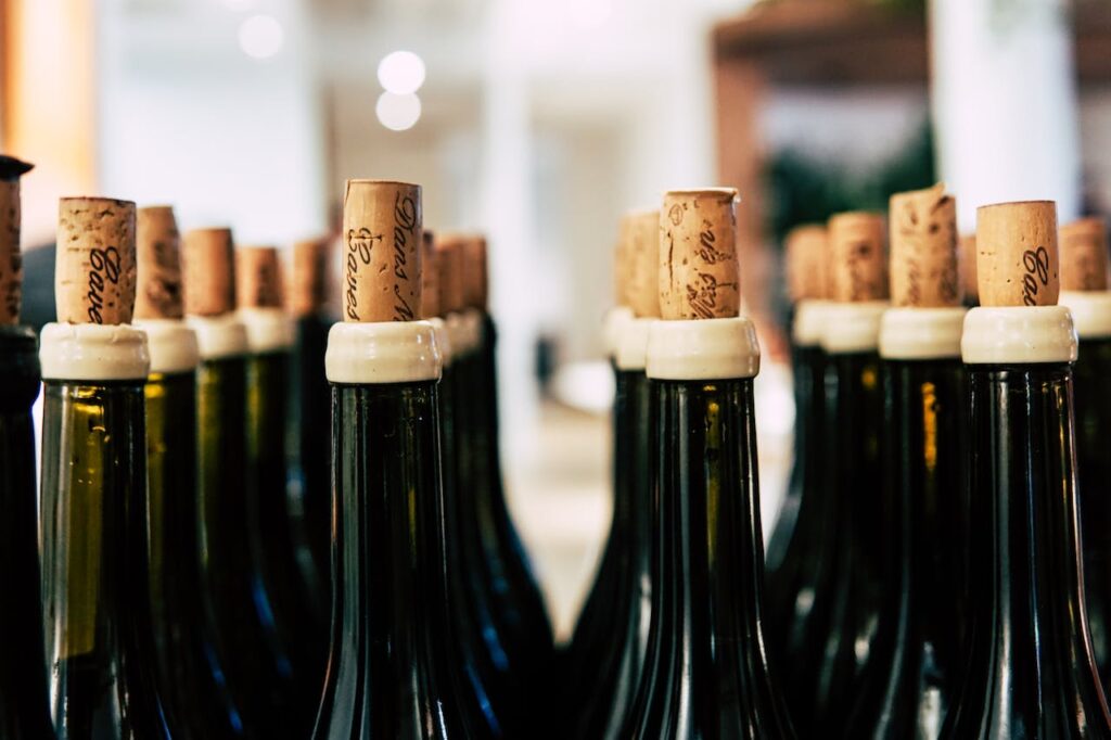 A row of wine bottles with corks on them, a must-see for wine enthusiasts visiting Troyes.