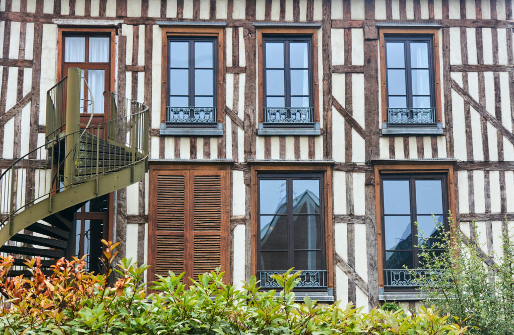 Troyes Restaurant, housed in a charming building with wooden shutters and a spiral staircase, offers a unique dining experience.